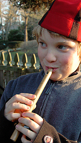 Boy Playing Bamboo Flute