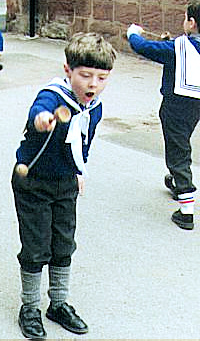 Boy with Cup & Ball Toss Toy